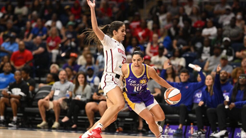 Jul 22, 2025; Washington, District of Columbia, USA; Los Angeles Sparks guard Kelsey Plum (10) attempts to drive past Washington Mystics guard Sonia Citron (22) during the first quarter at CareFirst Arena.