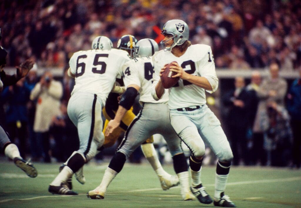Dec 23, 1972; Pittsburgh, PA, USA; FILE PHOTO; Oakland Raiders quarterback (12) Ken Stabler drops back to pass against the Pittsburgh Steelers during the 1972 AFC Divisional Playoff game at Three Rivers Stadium. The Steelers defeated the Raiders 13-7.