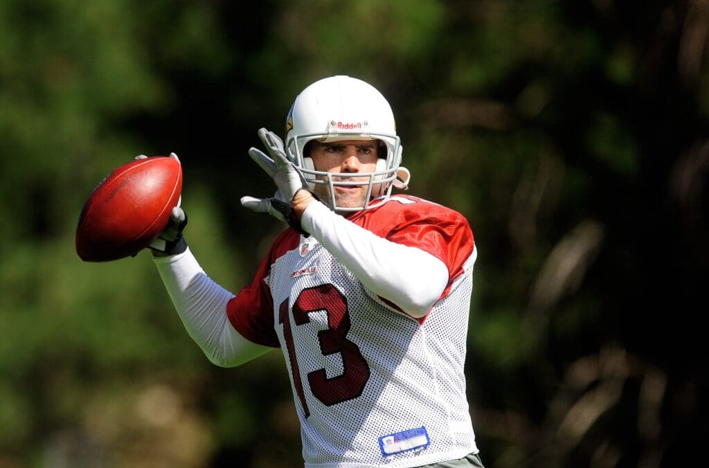 Jul 31, 2009; Flagstaff, AZ, USA; Arizona Cardinals quarterback Kurt Warner throws a pass during training camp on the campus of Northern Arizona University.