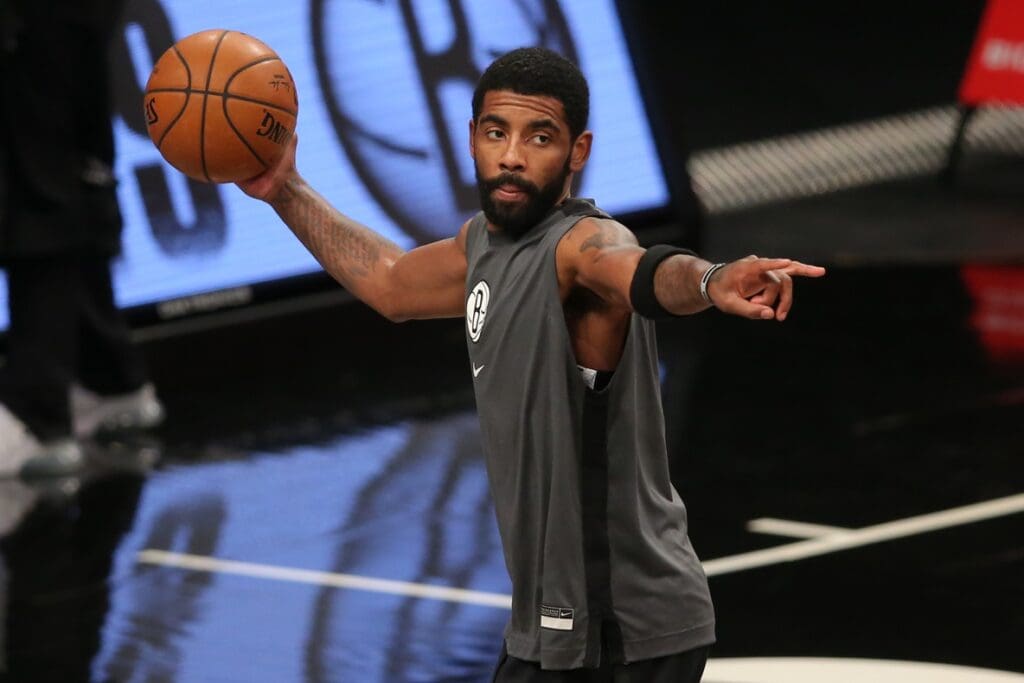 Jan 1, 2021; Brooklyn, New York, USA; Brooklyn Nets point guard Kyrie Irving (11) warms up before a game against the Atlanta Hawks at Barclays Center. 