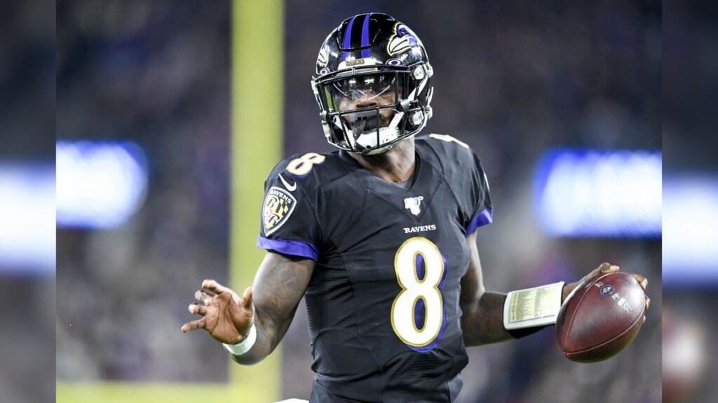 Nov 3, 2019; Baltimore, MD, USA; Baltimore Ravens quarterback Lamar Jackson (8) runs the ball in for a touchdown during the first quarter against the New England Patriots at M&T Bank Stadium.