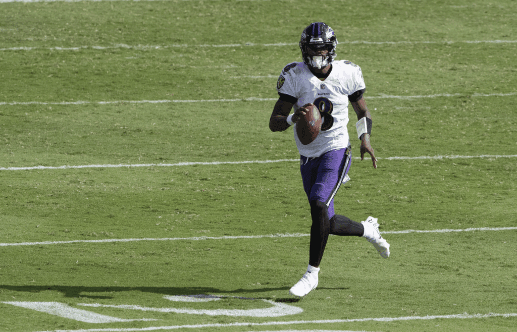 Sep 13, 2020; Baltimore, Maryland, USA; Baltimore Ravens quarterback Lamar Jackson (8) looks down field on the run during the second half against the Cleveland Browns at M&T Bank Stadium. 