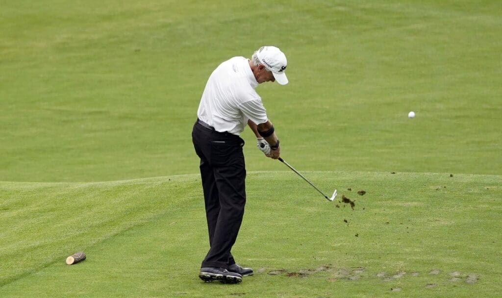 Nov 12, 2020; Augusta, Georgia, USA; Larry Mize plays his shot from the 12th tee during the first round of The Masters golf tournament at Augusta National GC.