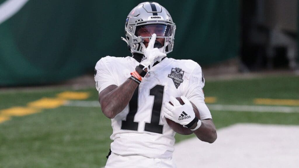 Dec 6, 2020; East Rutherford, NJ, USA; Las Vegas Raiders wide receiver Henry Ruggs III (11) celebrates after scoring a touchdown against the New York Jets in the fourth quarter of a NFL game at MetLife Stadium.