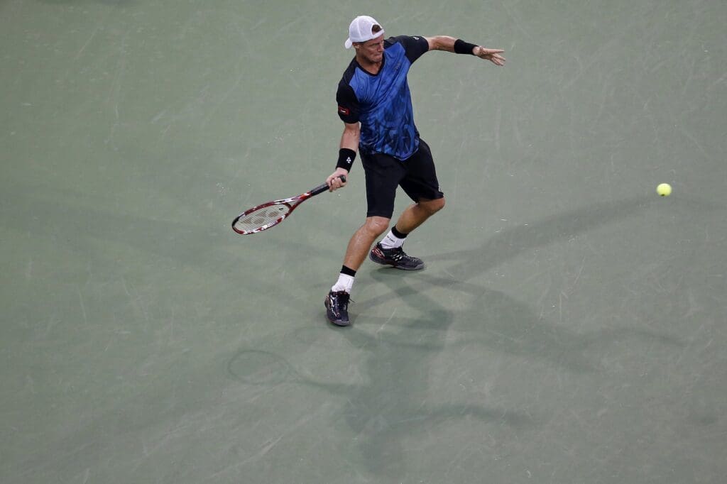 Sep 3, 2015; New York, NY, USA; Lleyton Hewitt of Australia his a forehand against Bernard Tomic of Australia (not pictured) on day four of the 2015 U.S. Open tennis tournament at USTA Billie Jean King National Tennis Center. Tomic won 6-3, 6-2, 3-6, 5-7, 7-5.
