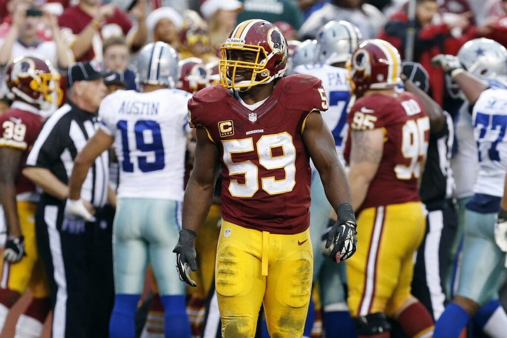 Dec 22, 2013; Landover, MD, USA; Washington Redskins inside linebacker London Fletcher (59) stands on the field after the Dallas Cowboys scored the game winning touchdown in the final minute of the fourth quarter at FedEx Field. The Cowboys won 24-23.