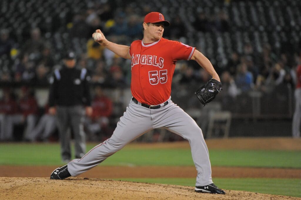 September 4, 2012; Oakland, CA, USA; Los Angeles Angels relief pitcher Jason Isringhausen (55) delivers a pitch during the ninth inning against the Oakland Athletics at O.co Coliseum. The Angels defeated the Athletics 6-1.