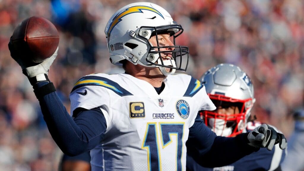 Jan 13, 2019; Foxborough, MA, USA; Los Angeles Chargers quarterback Philip Rivers (17) looks to pass under pressure from New England Patriots outside linebacker Dont'a Hightower (54) during the fourth quarter in an AFC Divisional playoff football game at Gillette Stadium.
