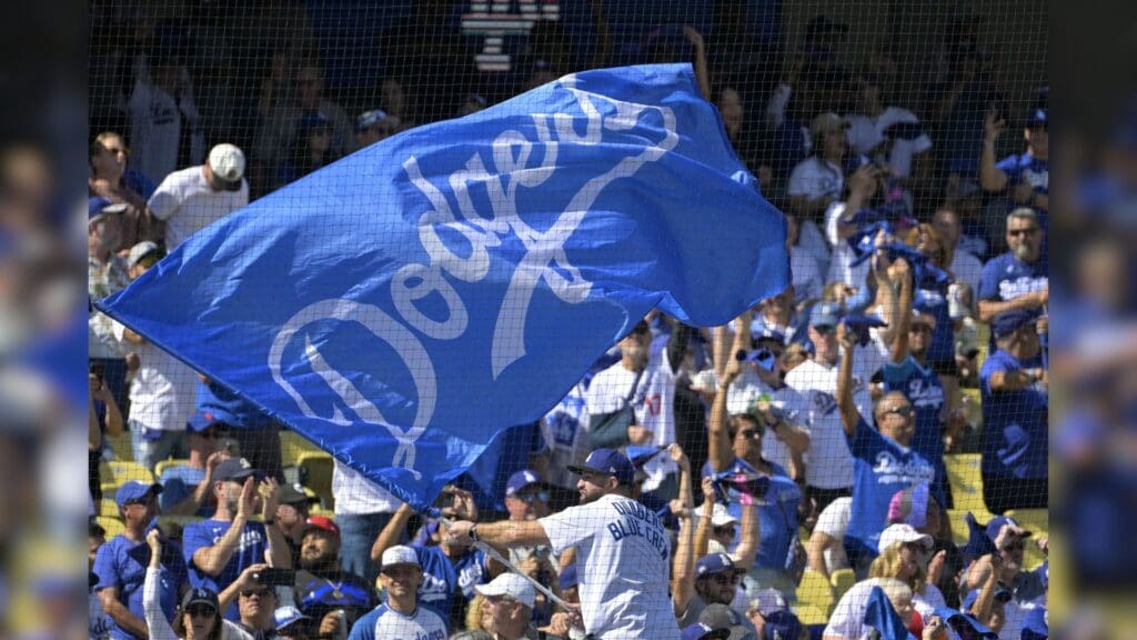 Oct 14, 2024; Los Angeles, California, USA; Los Angeles Dodgers fans cheer before game two against the New York Mets in the NLCS for the 2024 MLB Playoffs at Dodger Stadium. 