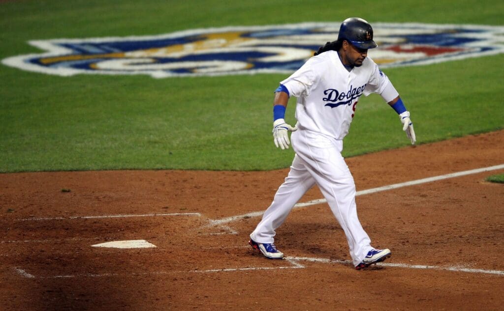 October 15, 2009; Los Angeles, CA, USA; Los Angeles Dodgers left fielder Manny Ramirez (99) following a two-run homerun during the fifth inning of game one of the 2009 NLCS against the Philadelphia Phillies at Dodger Stadium. 