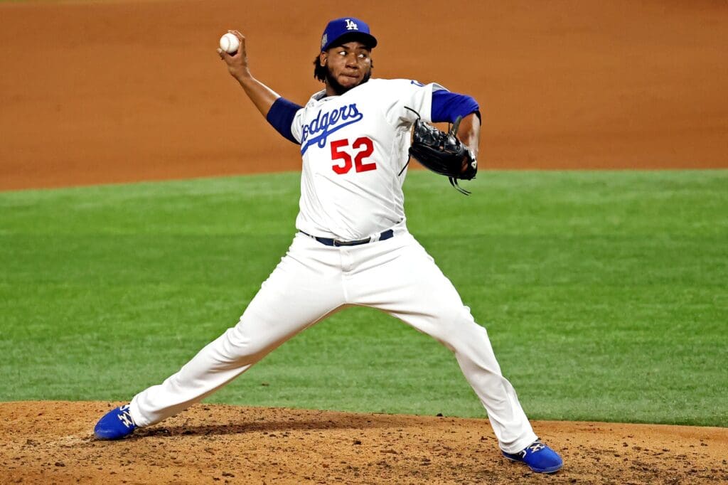 Oct 27, 2020; Arlington, Texas, USA; Los Angeles Dodgers relief pitcher Pedro Baez (52) pitches during the fifth inning against the Tampa Bay Rays during game six of the 2020 World Series at Globe Life Field. 