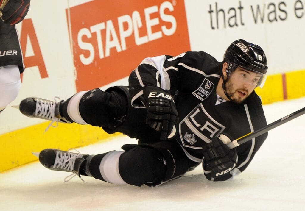 Jan. 19, 2012; Los Angeles, CA, USA; Los Angeles Kings defenseman Drew Doughty (8) hits the ice after a hit by Chicago Blackhawks center Jonathan Toews (not pictured) in the third period of the game at the Staples Center. Blackhawks won 5-2.