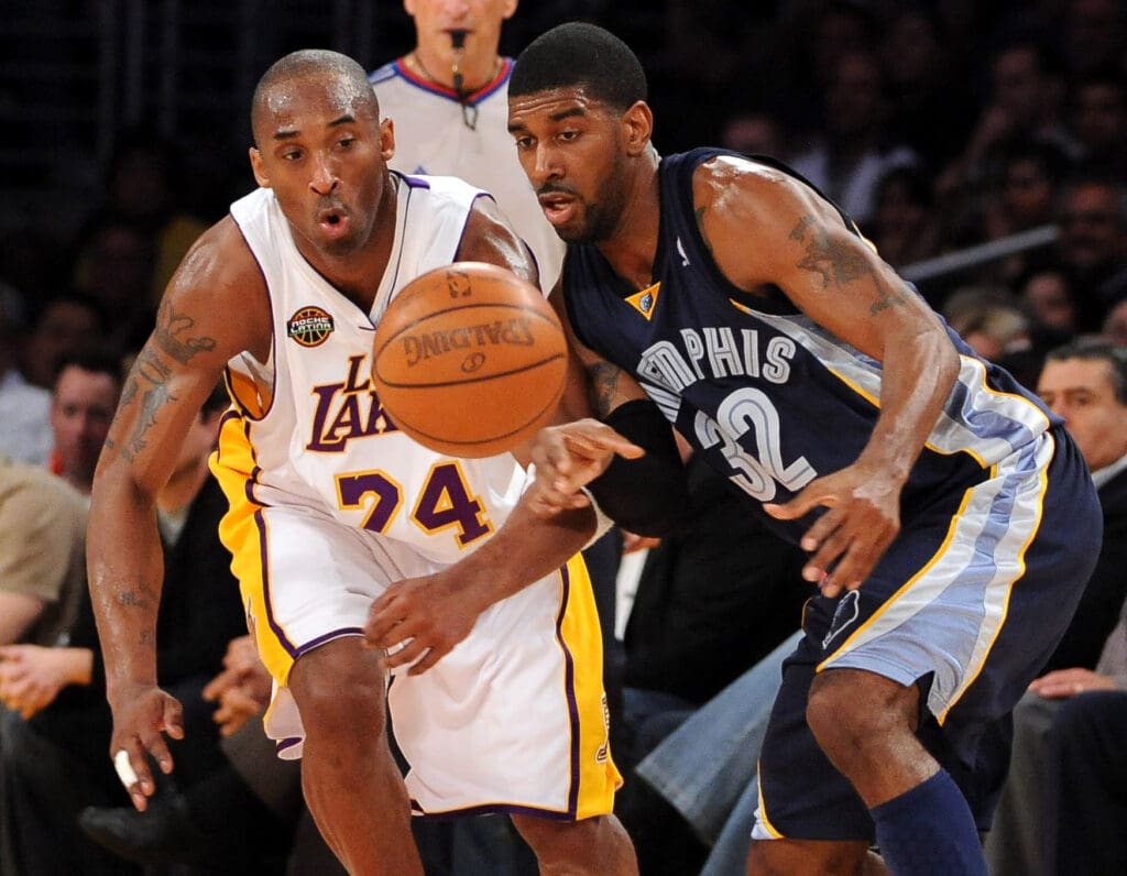 Mar 3, 2009; Los Angeles, CA, USA; Los Angeles Lakers guard Kobe Bryant (24), left, and Memphis Grizzlies guard O.J. Mayo (32) battle for the ball at the Staples Center. The Lakers defeated the Grizzlies 99-89