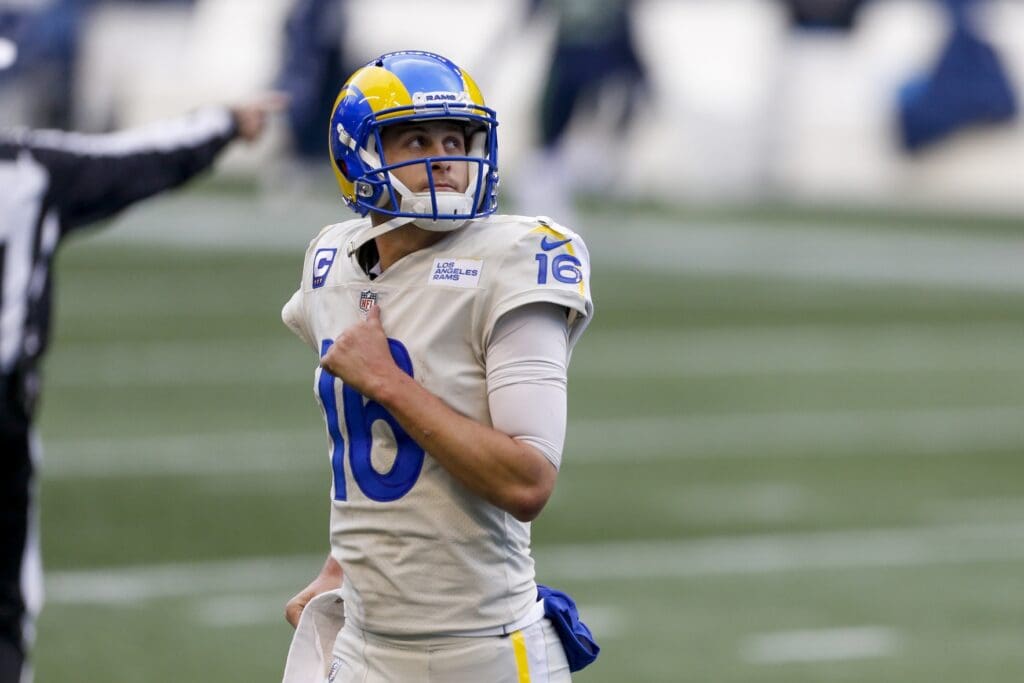 Dec 27, 2020; Seattle, Washington, USA; Los Angeles Rams quarterback Jared Goff (16) returns to the sideline following a turnover on downs against the Seattle Seahawks during the third quarter at Lumen Field.