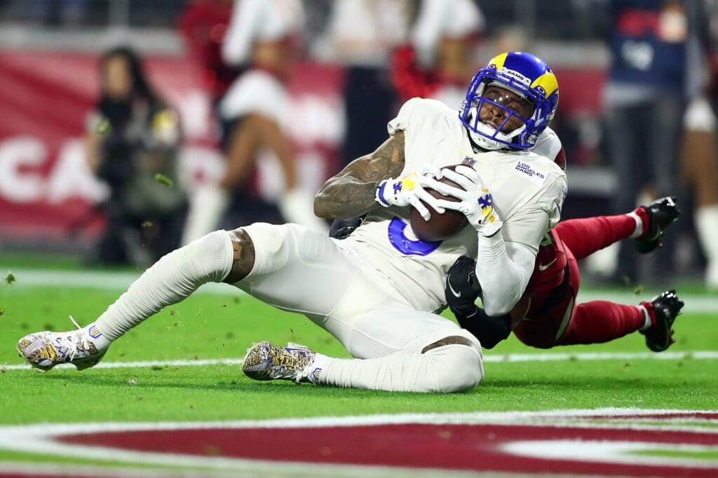 Dec 13, 2021; Glendale, Arizona, USA; Los Angeles Rams wide receiver Odell Beckham Jr. (3) scores a touchown against the Arizona Cardinals during the first half at State Farm Stadium.