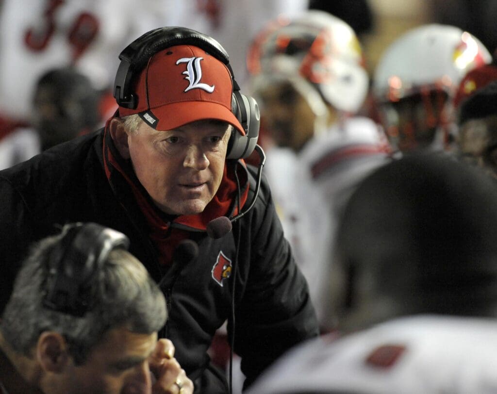 Nov 8, 2014; Boston, MA, USA; Louisville Cardinals head coach Bobby Petrino talks to his defense during the second half against the Boston College Eagles at Alumni Stadium.