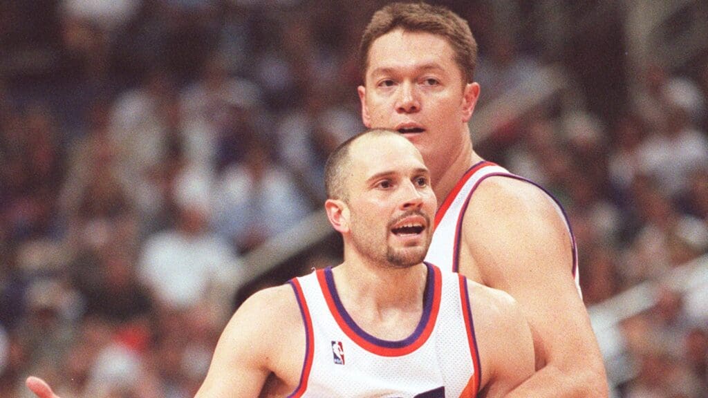 May 12, 1999; Phoenix, AZ, USA; FILE PHOTO; Suns center Luc Longley restrains teammate Rex Chapman, who was questioning a foul call during the first half of Game 3 at America West Arena. The Suns were swept by the Portland Trail Blazers in the series, 0-3.