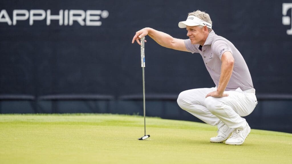 May 16, 2025; Charlotte, North Carolina, USA; Luke Donald looks over his line on the green at the second hole during the second round of the PGA Championship golf tournament at Quail Hollow. 