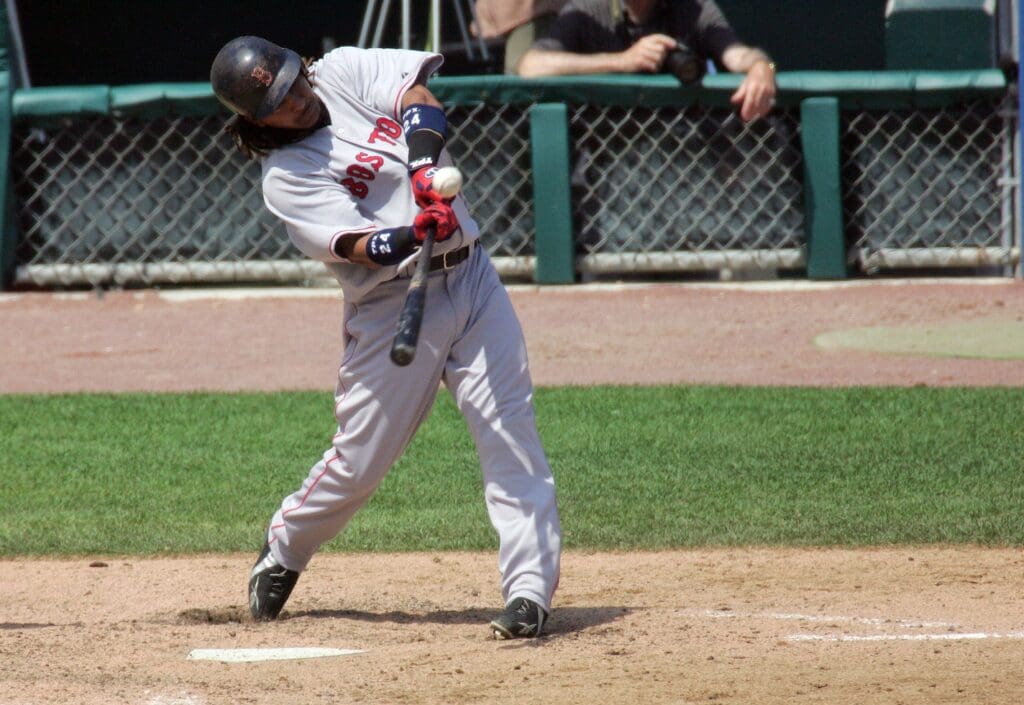 June 4, 2006; Detroit, MI, USA; Boston Red Sox left fielder (24) Manny Ramirez hits a home run to right field in the 7th inning against the Detroit Tigers at Comerica Park.