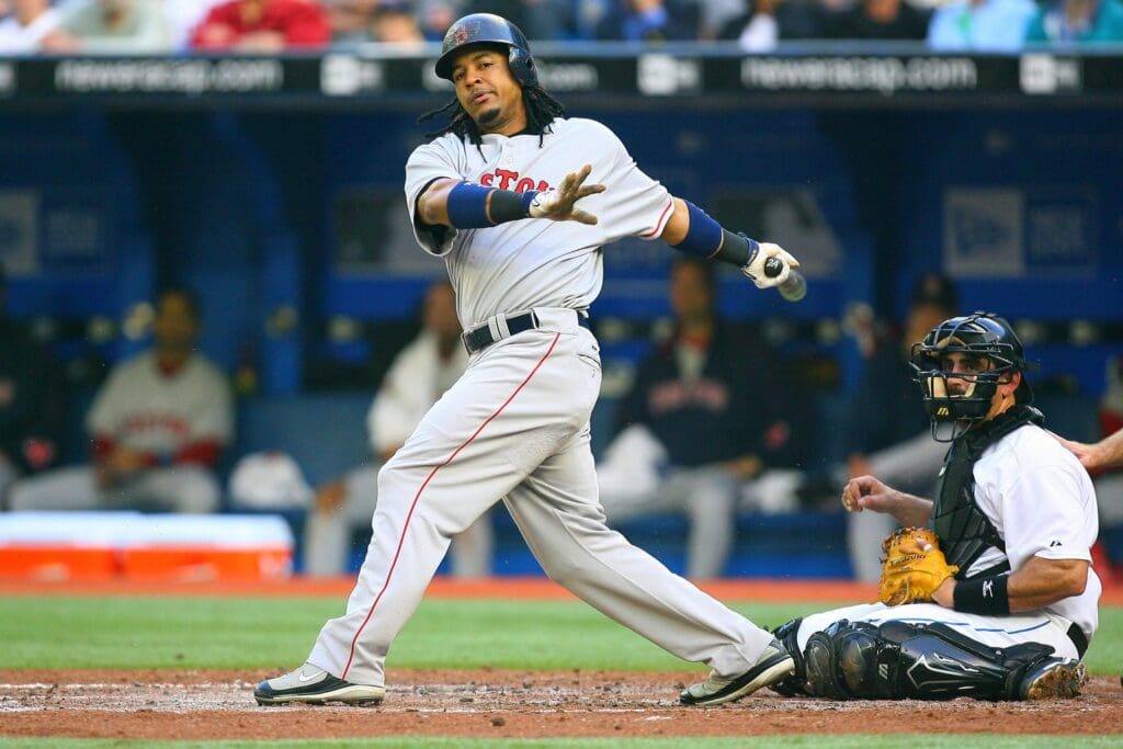 May 10, 2007; Toronto, ON, Canada; Boston Red Sox left fielder (24) Manny Ramirez bats as Toronto Blue Jays catcher (13) Sal Fasano looks on at the Rogers Centre in Toronto, ON. Boston won 8-0. 