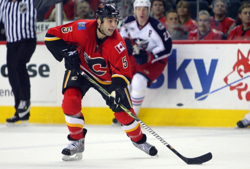 Jan 21, 2009; Calgary, AB, Canada; Calgary Flames defenseman Mark Giordano (5) with the puck against the Columbus Blue Jackets at the Pengrowth Saddledome. The Flames beat the Blue Jackets 5-4.