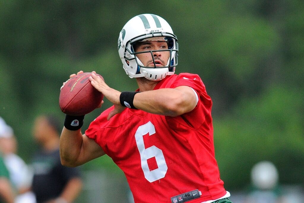 July 28, 2012; Cortland, NY, USA; New York Jets quarterback Mark Sanchez (6) prepares to throw a pass during training camp at SUNY Cortland.