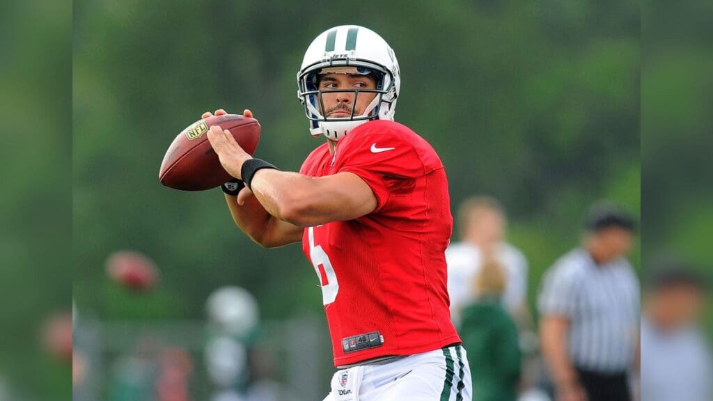 July 29, 2012; Cortland, NY, USA; New York Jets quarterback Mark Sanchez (6) prepares to throw a pass during training camp at SUNY Cortland.