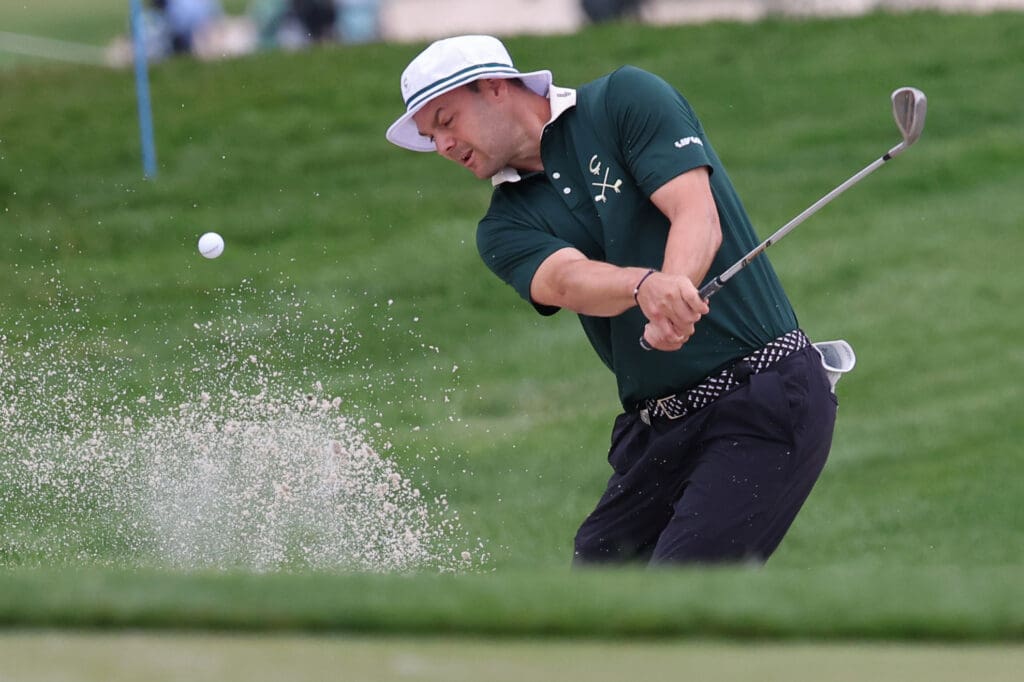 Jun 8, 2025; Gainesville, Virginia, USA; Martin Kaymer of team Cleeks Golf Club hits out of a greenside bunker on the third hole during the final round of the LIV Golf Virginia golf tournament at Robert Trent Jones Golf Club. 