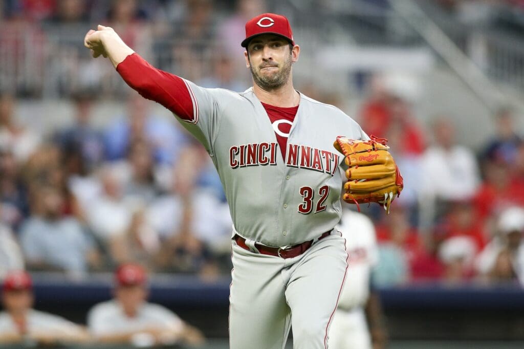 Jun 26, 2018; Atlanta, GA, USA; Cincinnati Reds starting pitcher Matt Harvey (32) throws a runner out at first against the Atlanta Braves in the fourth inning at SunTrust Park.