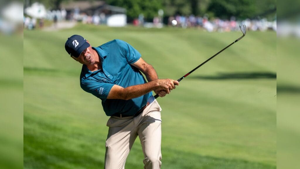 Jul 3, 2025; Silvis, Illinois, USA; Matt Kuchar hits a chip shot on the 9th hole during the first round of the John Deere Classic golf tournament. 