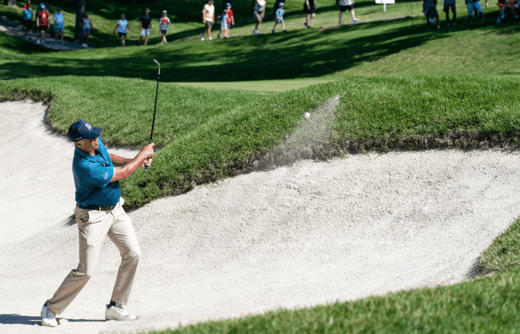 Jul 3, 2025; Silvis, Illinois, USA; Matt Kuchar hits a sand shot on the 9th hole during the first round of the John Deere Classic golf tournament.