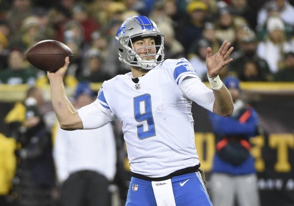 Nov 6, 2017; Green Bay, WI, USA; Detroit Lions quarterback Matthew Stafford (9) throws a touchdown pass in the fourth quarter during the game against the Green Bay Packers at Lambeau Field.