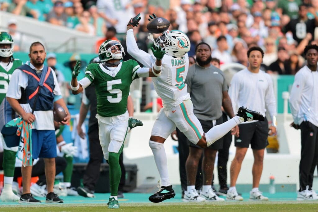 Dec 8, 2024; Miami Gardens, Florida, USA; Miami Dolphins cornerback Jalen Ramsey (5) breaks a pass intended to New York Jets wide receiver Garrett Wilson (5) during the third quarter at Hard Rock Stadium. 