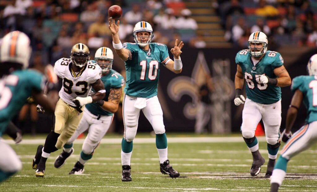 September 3, 2009; New Orleans, LA, USA; Miami Dolphins quarterback Chad Pennington (10) scrambles up the middle throwing against the New Orleans Saints during the 1st quarter of their preseason game at the Louisiana Superdome.