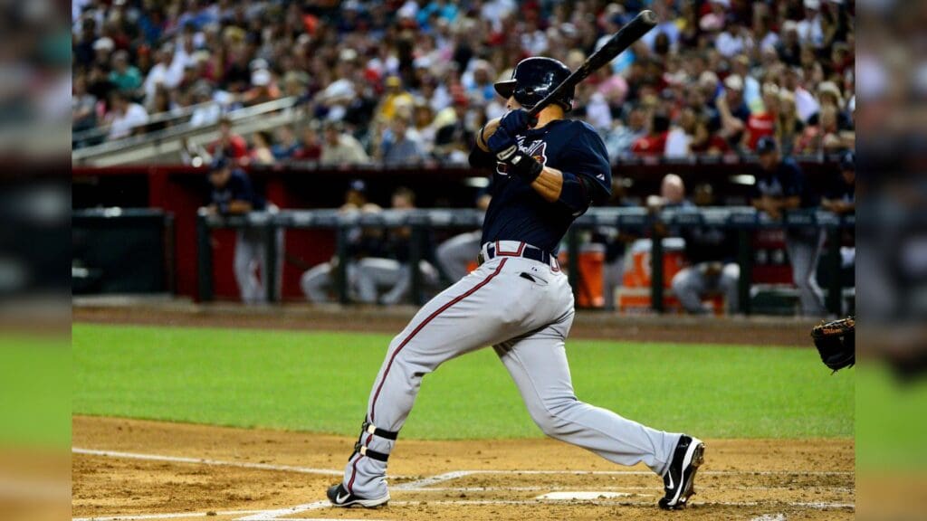 Apr. 20, 2012; Phoenix, AZ, USA; Atlanta Braves center fielder Michael Bourn (24) hits a single during the third inning against the Arizona Diamondbacks at Chase Field