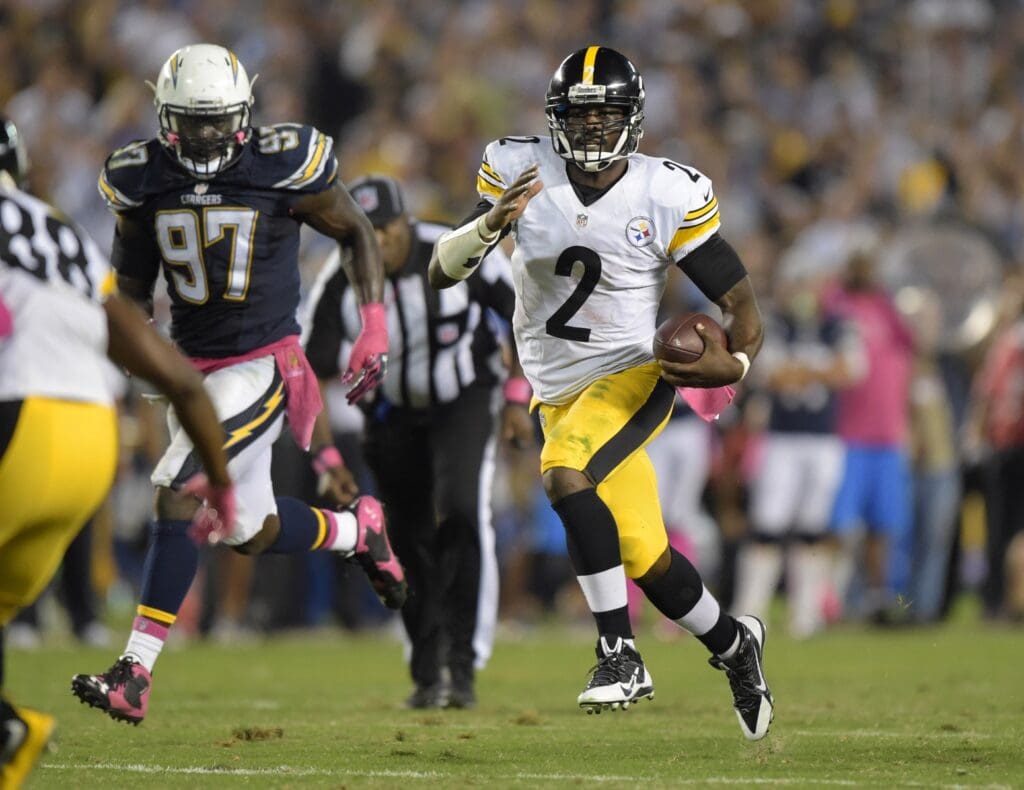 Oct 12, 2015; San Diego, CA, USA; Pittsburgh Steelers quarterback Michael Vick (2) rushes for a 24-yard gain pursued by San Diego Chargers linebacker Jerry Attaochu (97) the fourth quarter at Qualcomm Stadium.