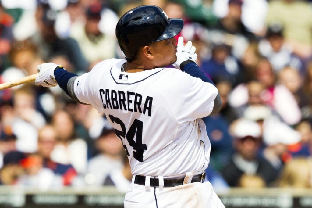 April 21, 2012; Detroit, MI, USA; Detroit Tigers third baseman Miguel Cabrera (24) hits a two run home run during the eighth inning against the Texas Rangers at Comerica Park.