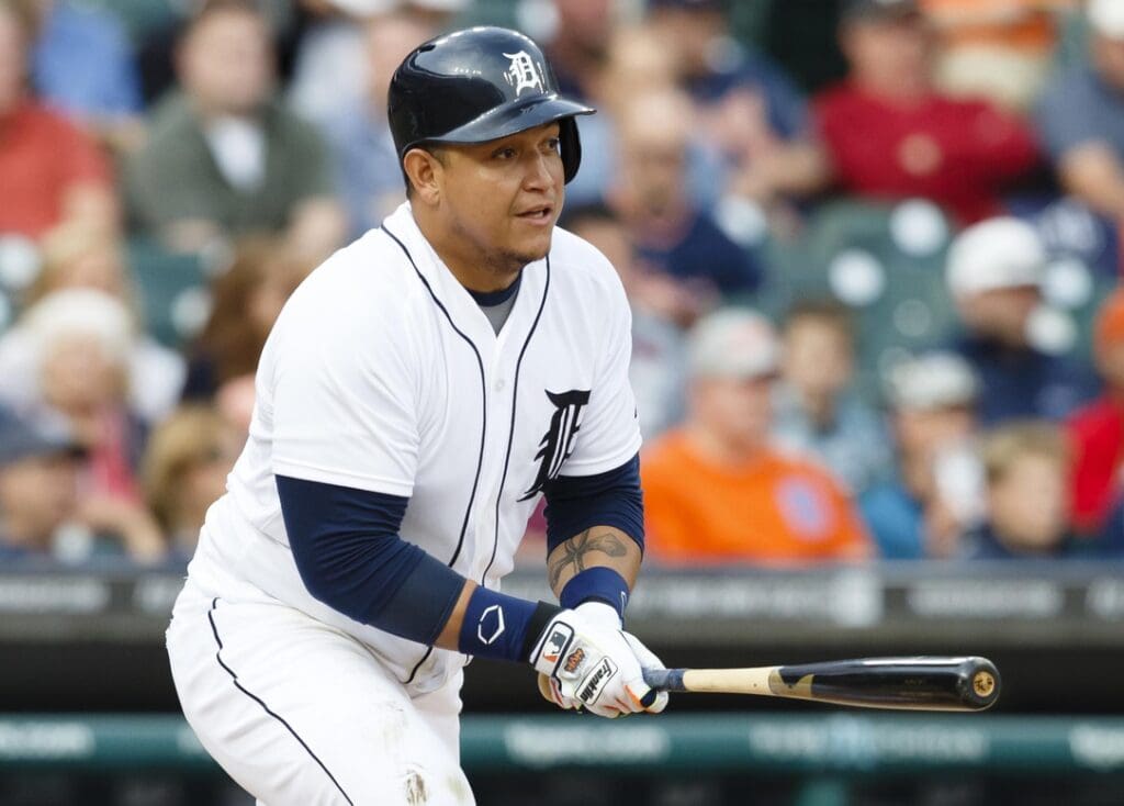 Jul 29, 2014; Detroit, MI, USA; Detroit Tigers first baseman Miguel Cabrera (24) hits a single in the first inning against the Chicago White Sox at Comerica Park.
