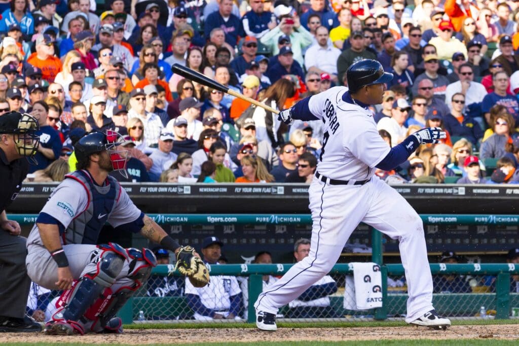 April 7, 2012; Detroit, MI, USA; Detroit Tigers third baseman Miguel Cabrera (24) at bat as Boston Red Sox catcher Jarrod Saltalamacchia (39) catches at Comerica Park.
