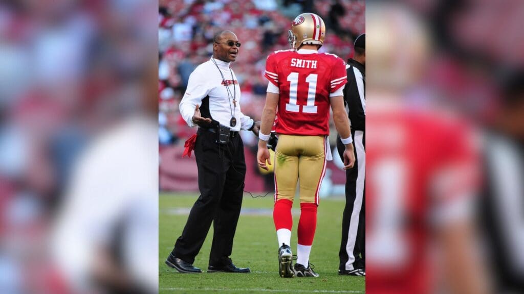 November 29, 2009; San Francisco, CA, USA; San Francisco 49ers head coach Mike Singletary (left) talks to quarterback Alex Smith (11) during the fourth quarter against the Jacksonville Jaguars at Candlestick Park. The 49ers defeated the Jaguars 20-3.