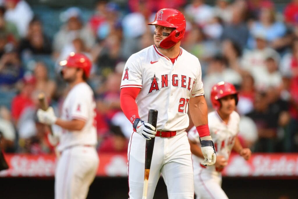 Jul 30, 2025; Anaheim, California, USA; Los Angeles Angels designated hitter Mike Trout (27) reacts after striking out with bases loaded against the Texas Rangers during the third inning at Angel Stadium. 