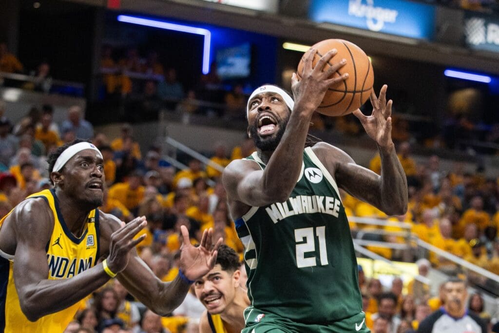 May 2, 2024; Indianapolis, Indiana, USA; Milwaukee Bucks guard Patrick Beverley (21) shoots the ball while Indiana Pacers forward Pascal Siakam (43) defends during game six of the first round for the 2024 NBA playoffs at Gainbridge Fieldhouse.