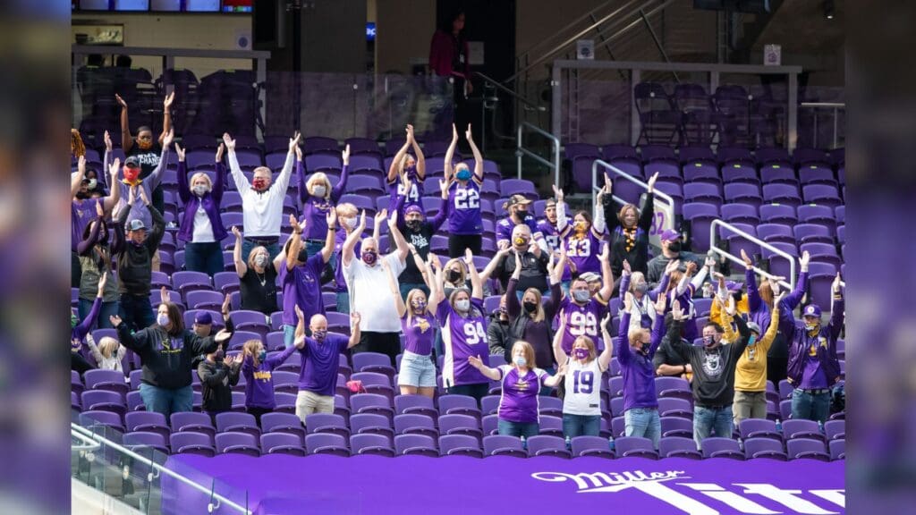 Sep 27, 2020; Minneapolis, Minnesota, USA; Minnesota Vikings fan cheer during the game between the Minnesota Vikings and Tennessee Titans at U.S. Bank Stadium.