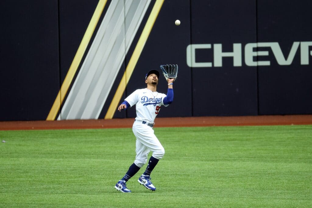 Oct 17, 2020; Arlington, Texas, USA; Los Angeles Dodgers right fielder Mookie Betts (50) catches the ball in the first inning for an out against the Atlanta Braves during game six of the 2020 NLCS at Globe Life Field. 