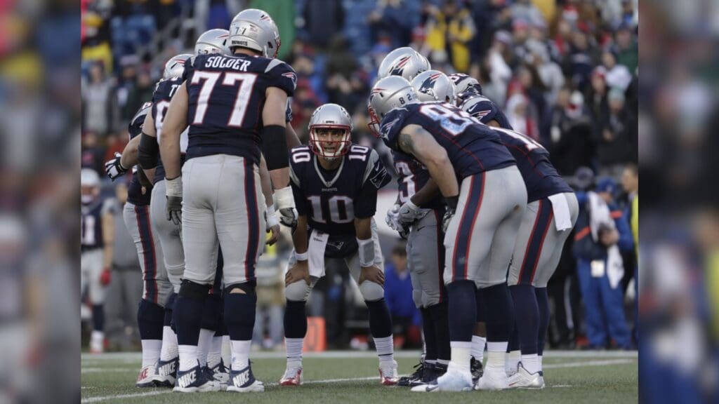 Dec 24, 2016; Foxborough, MA, USA; New England Patriots quarterback Jimmy Garoppolo (10) huddles with teammates against the New York Jets in the second half at Gillette Stadium. The Patriots defeated the Jets 41-3.