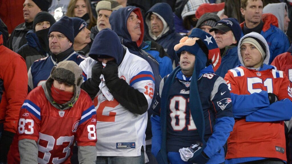 Jan 20, 2013; Foxboro, MA, USA; New England Patriots fans react in the fourth quarter of the AFC Championship game against the Baltimore Ravens at Gillette Stadium. The Ravens defeated the Patriots 28-13