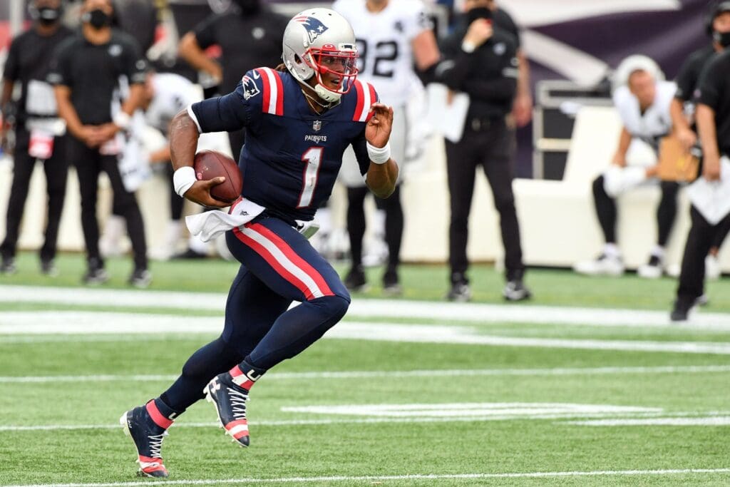 Sep 27, 2020; Foxborough, Massachusetts, USA; New England Patriots quarterback Cam Newton (1) runs with the ball against the Las Vegas Raiders during the fourth quarter at Gillette Stadium.