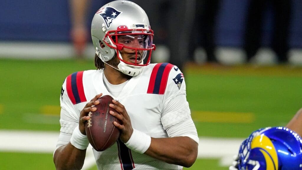Dec 10, 2020; Inglewood, California, USA; New England Patriots quarterback Cam Newton (1) throws a pass against the Los Angeles Rams during the first half at SoFi Stadium.