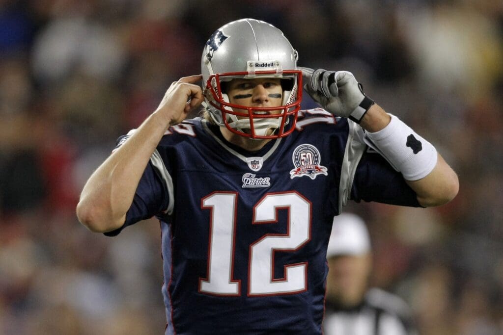 Nov 22, 2009; Foxborough, MA, USA; New England Patriots quarterback Tom Brady (12) signals before the play as they take on the New York Jets during the fourth quarter at Gillette Stadium. The Patriots defeated the Jets 31-14.