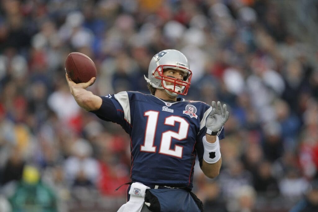 Dec 13, 2009; Foxborough, MA, USA; New England Patriots quarterback Tom Brady (12) throws a pass against the Carolina Panthers during the first quarter at Gillette Stadium.